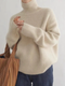 Rullekravesweater i uldblanding